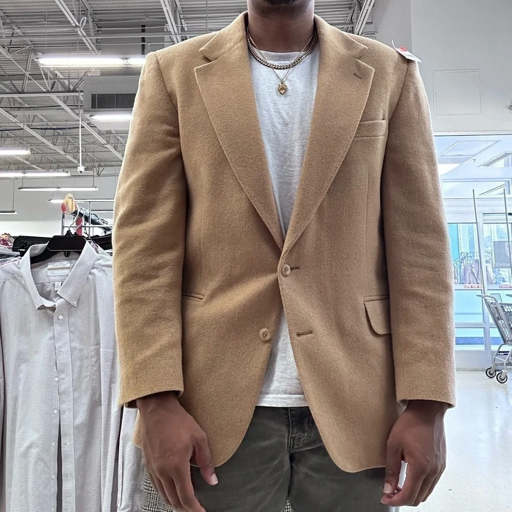 Brand: Robert Stock  Tan blazer with a 2 button closure, 2 front pockets.